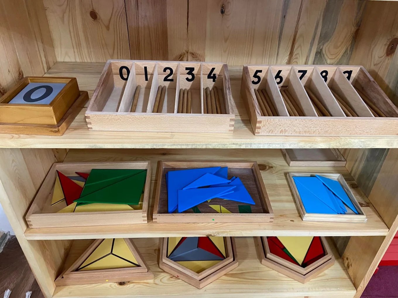 Mathematics materials on a shelf: spindle boxes and constructive triangles