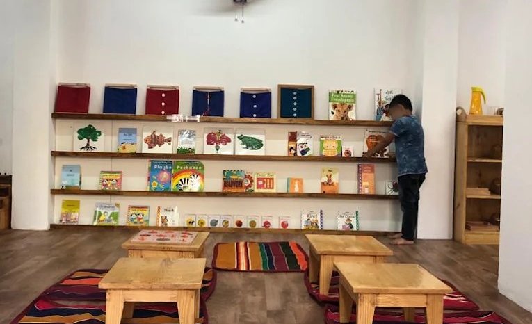 The reading corner, with picture books on low shelves
